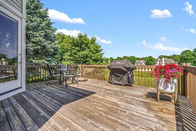 7639 Dunross Dr, Portage, MI 49024 - wooden deck featuring grilling area and outdoor dining space