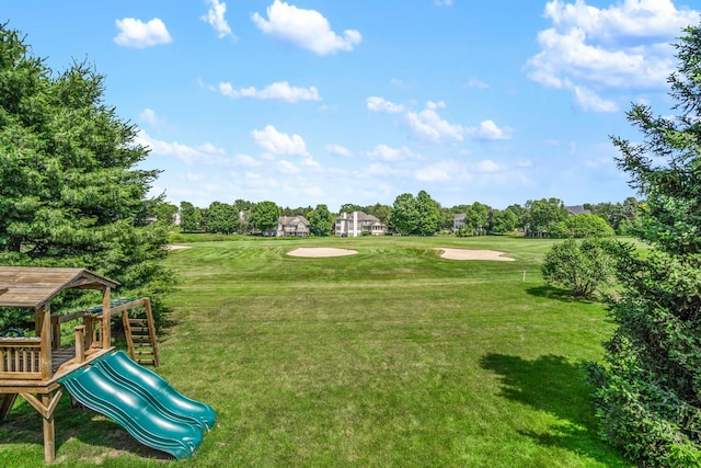 7639 Dunross Dr, Portage, MI 49024 - view of property's community featuring a yard, view of wooded area, and view of golf course