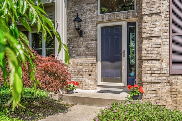7639 Dunross Dr, Portage, MI 49024 - view of exterior entry featuring brick siding
