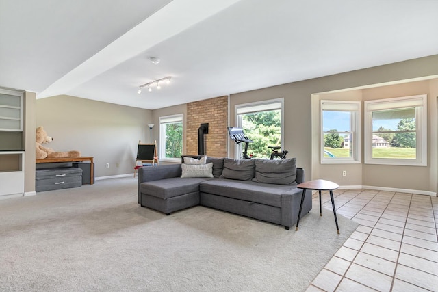 7639 Dunross Dr, Portage, MI 49024 - living room featuring light tile patterned floors and track lighting