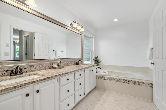 7639 Dunross Dr, Portage, MI 49024 - full bath featuring double vanity, a bath, and tile patterned floors