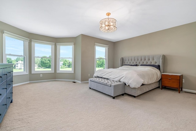 7639 Dunross Dr, Portage, MI 49024 - bedroom with light carpet and a chandelier