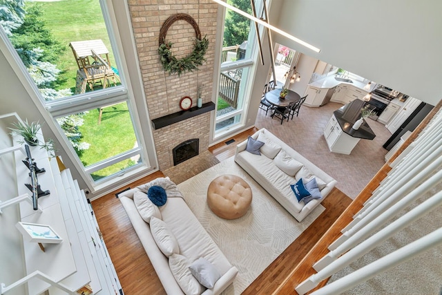 7639 Dunross Dr, Portage, MI 49024 - living room with a fireplace and wood finished floors