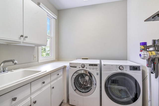 7639 Dunross Dr, Portage, MI 49024 - laundry area with cabinet space and washer and clothes dryer