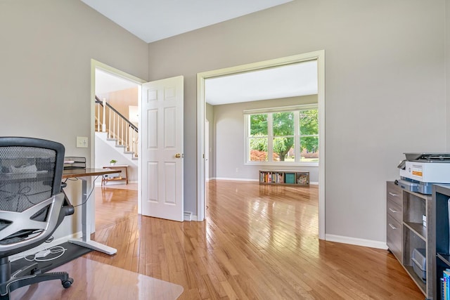 7639 Dunross Dr, Portage, MI 49024 - office area with light wood-style flooring and baseboards