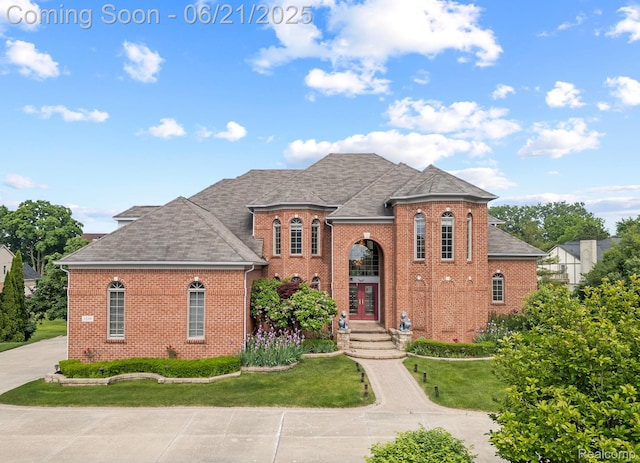1539 Bartley Ln, Bloomfield Hills, MI 48304 - french country style house featuring brick siding, roof with shingles, french doors, and a front lawn