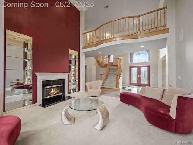 1539 Bartley Ln, Bloomfield Hills, MI 48304 - living area featuring a towering ceiling, stairs, carpet floors, and a tile fireplace