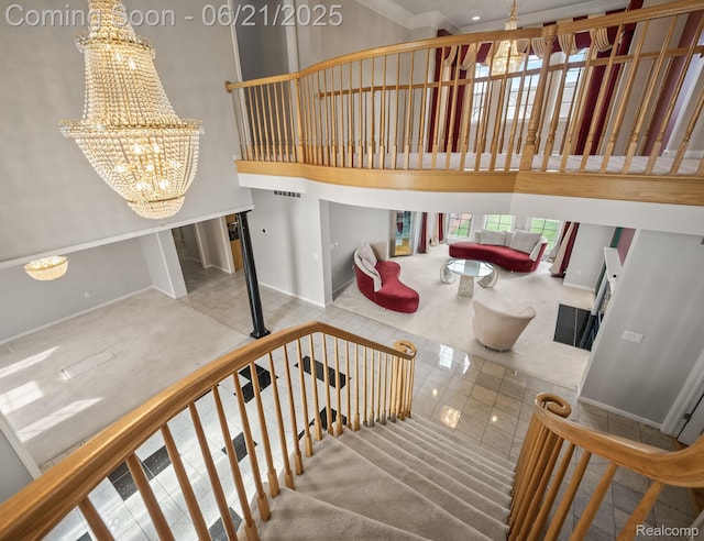 1539 Bartley Ln, Bloomfield Hills, MI 48304 - stairway with a chandelier, tile patterned floors, a towering ceiling, and ornamental molding