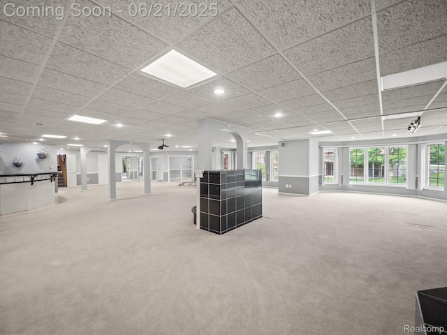 1539 Bartley Ln, Bloomfield Hills, MI 48304 - unfurnished living room featuring carpet flooring, arched walkways, recessed lighting, and a paneled ceiling