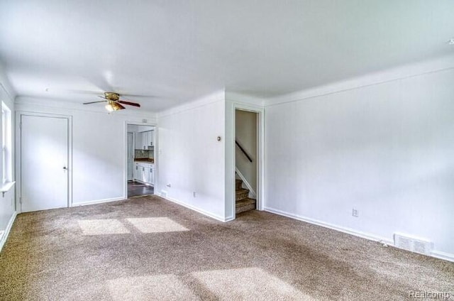 17710 Chester St, Detroit, MI 48224 - spare room featuring a ceiling fan, carpet flooring, and stairs