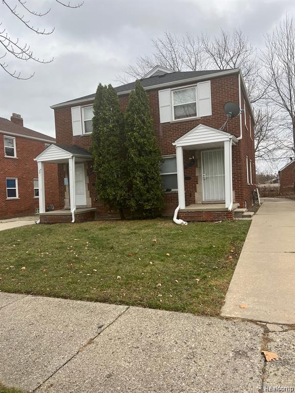 17710 Chester St, Detroit, MI 48224 - view of front of property with brick siding and a front lawn