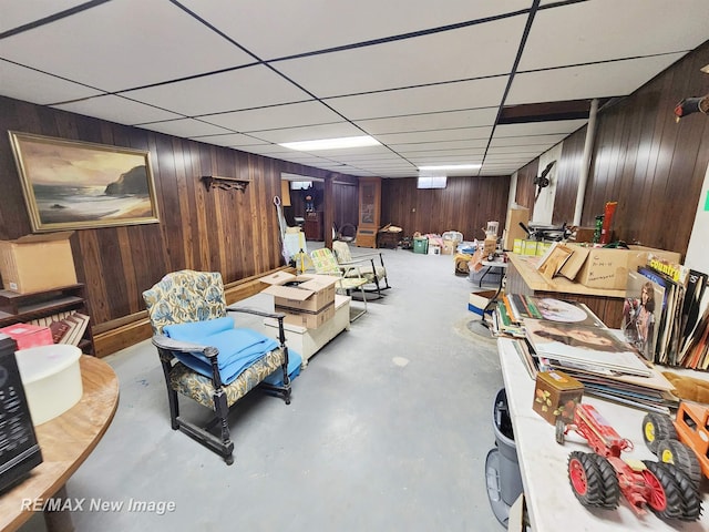 504 Abingdon St, Chesaning, MI 48616 - finished basement featuring wooden walls and a drop ceiling