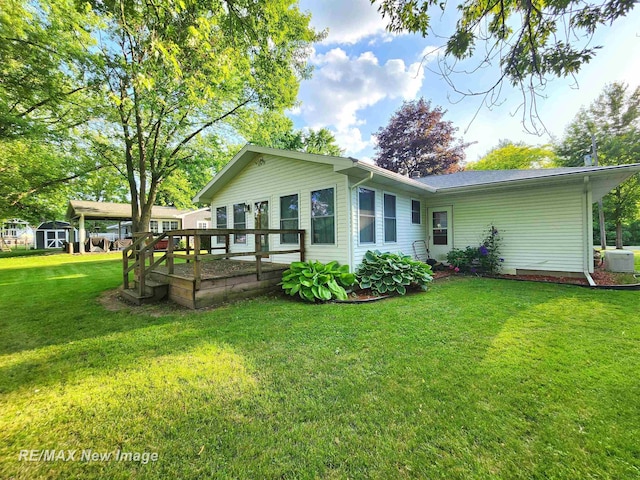 504 Abingdon St, Chesaning, MI 48616 - rear view of property with a yard and an outbuilding