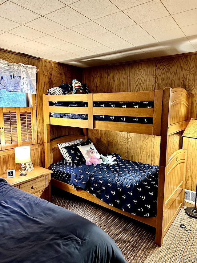 24579 US Highway 23 N, Ocqueoc, MI 49759 - bedroom with wooden walls and carpet floors