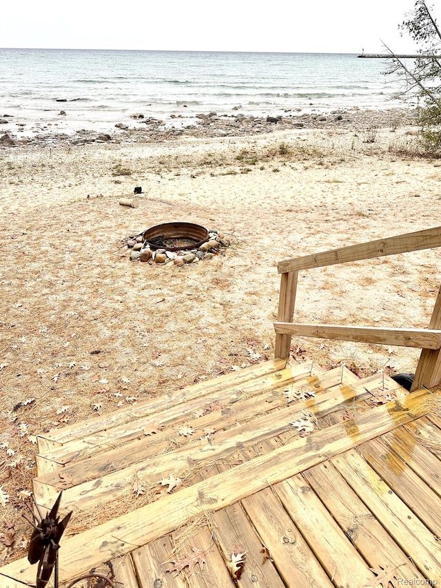 24579 US Highway 23 N, Ocqueoc, MI 49759 - wooden deck featuring view of water and beach