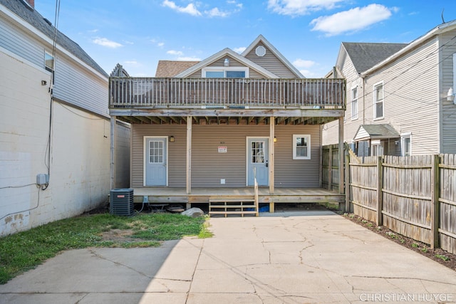 831 Bridge St NW, Grand Rapids, MI 49504 - rear view of house featuring a wooden deck