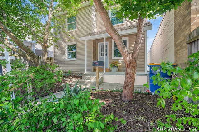 831 Bridge St NW, Grand Rapids, MI 49504 - rear view of house featuring covered porch