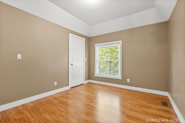 831 Bridge St NW, Grand Rapids, MI 49504 - empty room with light wood-style floors and baseboards