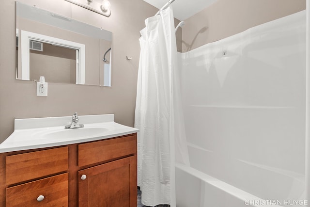 831 Bridge St NW, Grand Rapids, MI 49504 - bathroom featuring vanity and shower / tub combo