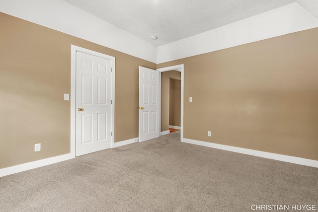 831 Bridge St NW, Grand Rapids, MI 49504 - carpeted empty room featuring baseboards