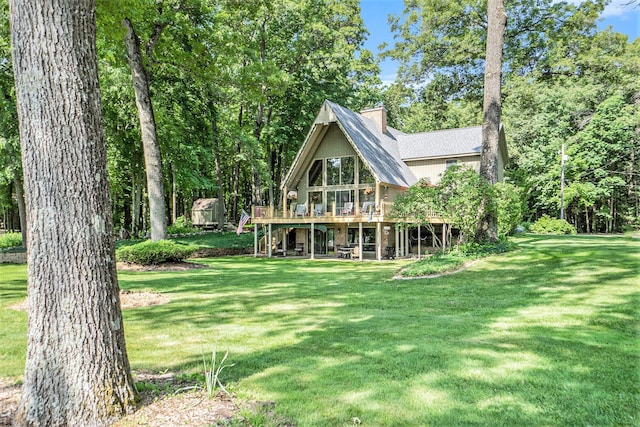 5254 Morrison St, Newaygo, MI 49337 - back of house featuring a deck, a lawn, and stairs