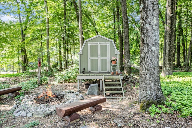5254 Morrison St, Newaygo, MI 49337 - view of yard featuring a fire pit and a storage unit