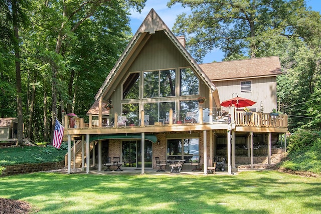 5254 Morrison St, Newaygo, MI 49337 - rear view of house featuring stairway, a deck, a chimney, a patio area, and a yard