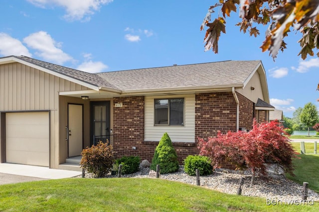679 Waterview Ct SW, Grandville, MI 49418 - single story home featuring brick siding, an attached garage, roof with shingles, a front lawn, and concrete driveway