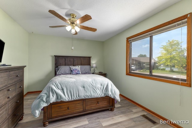 679 Waterview Ct SW, Grandville, MI 49418 - bedroom with light wood-style floors and a ceiling fan