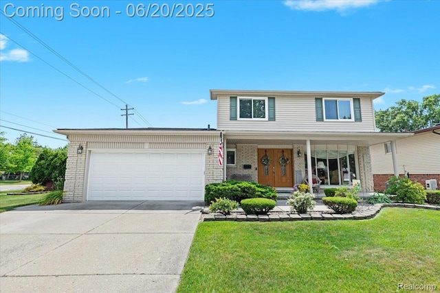 43603 Arlington Rd, Canton, MI 48187 - traditional-style home with brick siding, a garage, a front lawn, and driveway