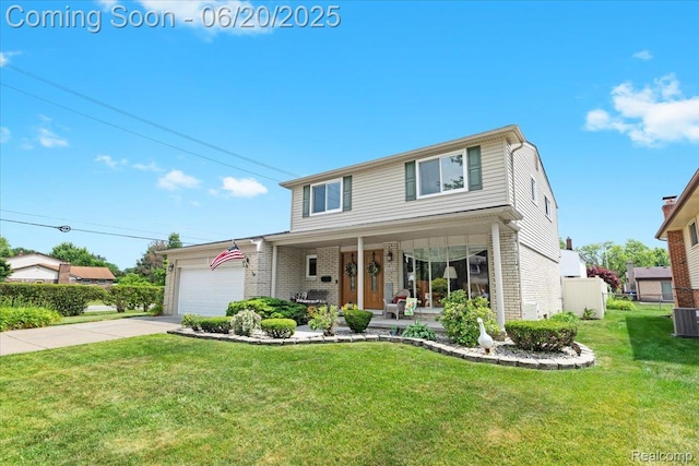 43603 Arlington Rd, Canton, MI 48187 - traditional home with covered porch, brick siding, and an attached garage