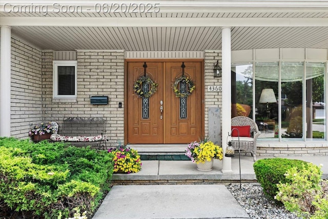 43603 Arlington Rd, Canton, MI 48187 - view of exterior entry with brick siding and covered porch