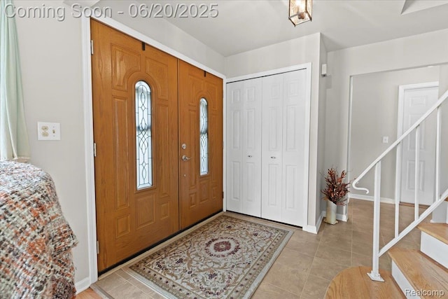 43603 Arlington Rd, Canton, MI 48187 - entryway featuring stairway and light tile patterned flooring