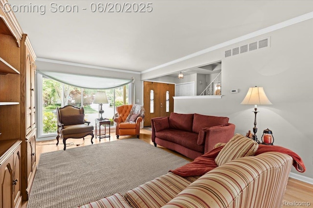 43603 Arlington Rd, Canton, MI 48187 - living room featuring crown molding and light wood-style floors