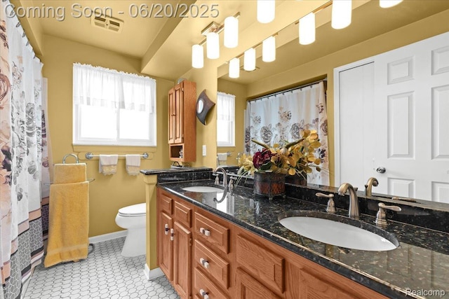 43603 Arlington Rd, Canton, MI 48187 - full bathroom with double vanity and toilet