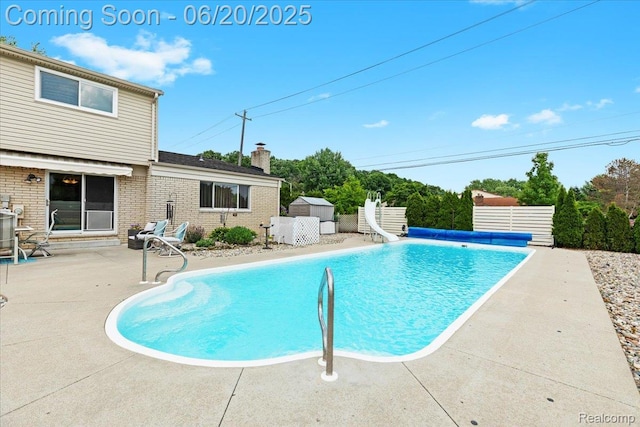 43603 Arlington Rd, Canton, MI 48187 - view of swimming pool with a water slide, a patio area, and a covered pool