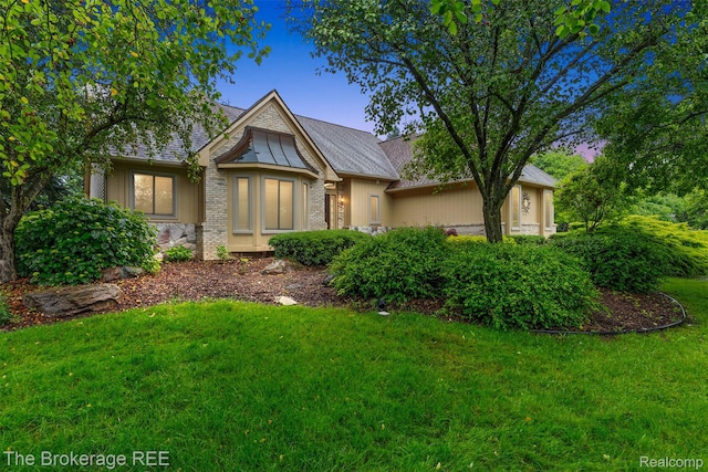 2048 Mayfair Dr, White Lake, MI 48383 - tudor-style house featuring a front lawn