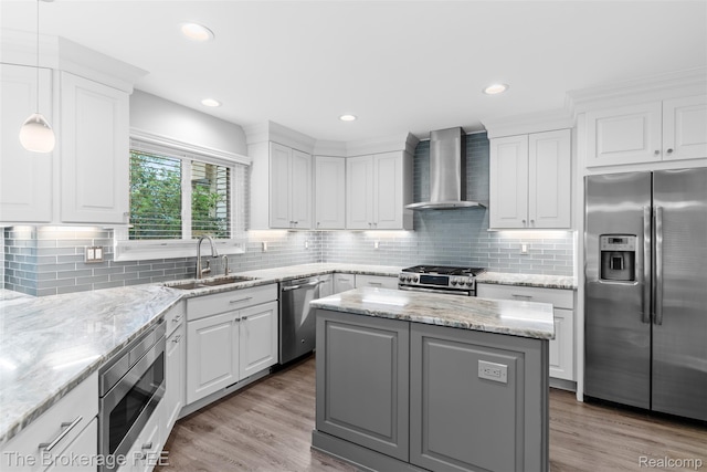 2048 Mayfair Dr, White Lake, MI 48383 - kitchen featuring stainless steel appliances, wall chimney exhaust hood, a center island, white cabinetry, and recessed lighting