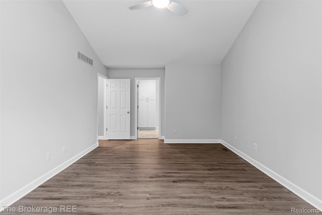 2048 Mayfair Dr, White Lake, MI 48383 - empty room featuring ceiling fan, lofted ceiling, and dark wood-style flooring