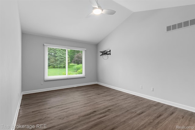 2048 Mayfair Dr, White Lake, MI 48383 - empty room featuring vaulted ceiling, dark wood-type flooring, and a ceiling fan