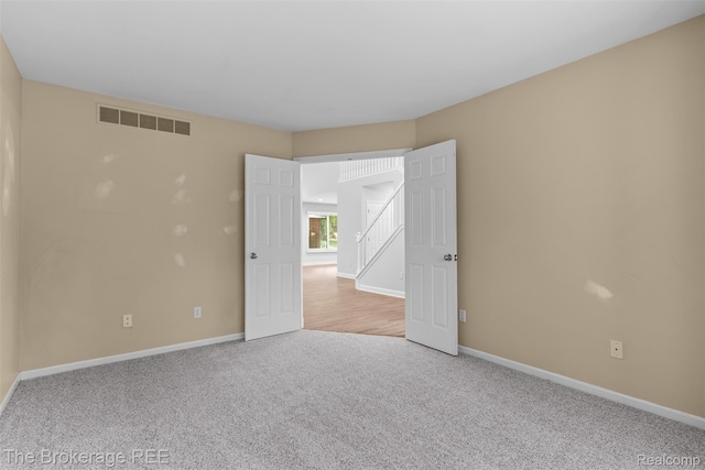 2048 Mayfair Dr, White Lake, MI 48383 - spare room with carpet flooring and baseboards