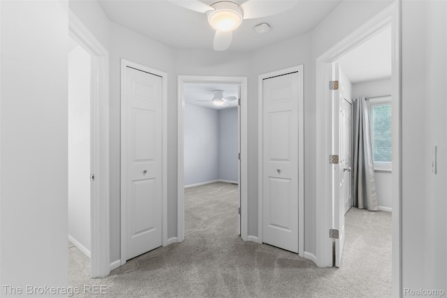 2048 Mayfair Dr, White Lake, MI 48383 - corridor featuring carpet floors and baseboards
