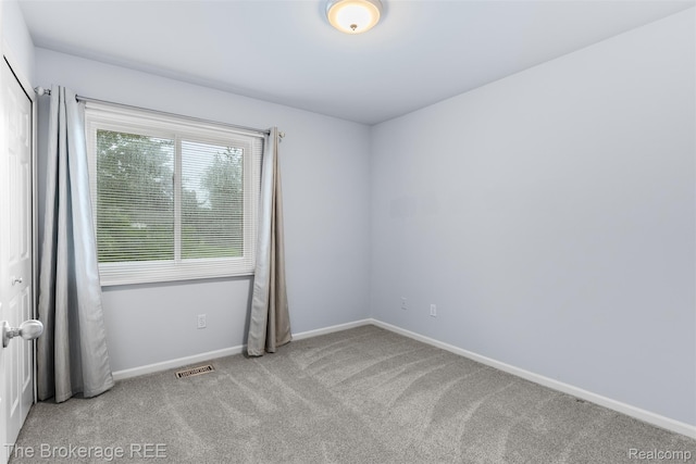 2048 Mayfair Dr, White Lake, MI 48383 - carpeted spare room featuring baseboards