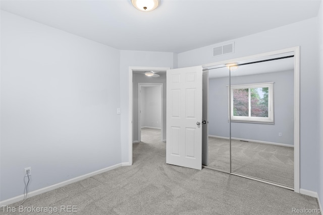 2048 Mayfair Dr, White Lake, MI 48383 - unfurnished bedroom featuring carpet and a closet
