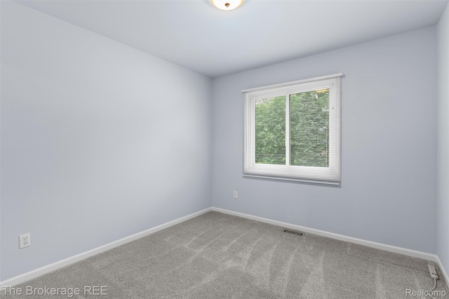 2048 Mayfair Dr, White Lake, MI 48383 - carpeted spare room featuring baseboards