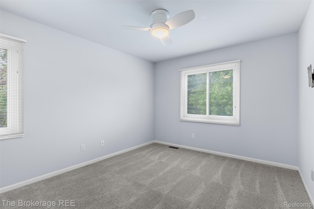 2048 Mayfair Dr, White Lake, MI 48383 - unfurnished room featuring a ceiling fan and carpet floors