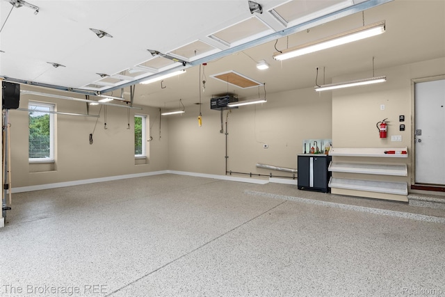 2048 Mayfair Dr, White Lake, MI 48383 - garage featuring baseboards
