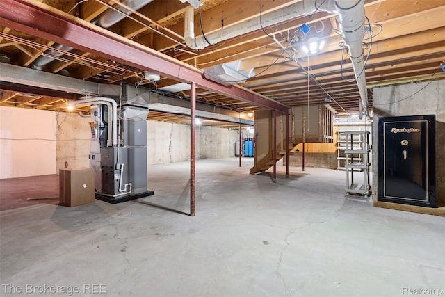 2048 Mayfair Dr, White Lake, MI 48383 - unfinished below grade area featuring heating unit and stairway