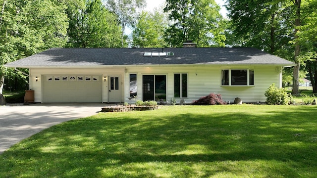 5724 E Townline Rd, Birch Run, MI 48415 - ranch-style home featuring a garage, a front yard, a chimney, and driveway
