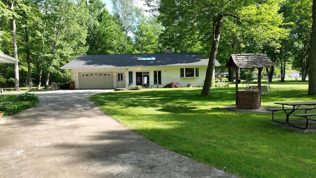 5724 E Townline Rd, Birch Run, MI 48415 - single story home featuring driveway, a garage, a front yard, and a chimney